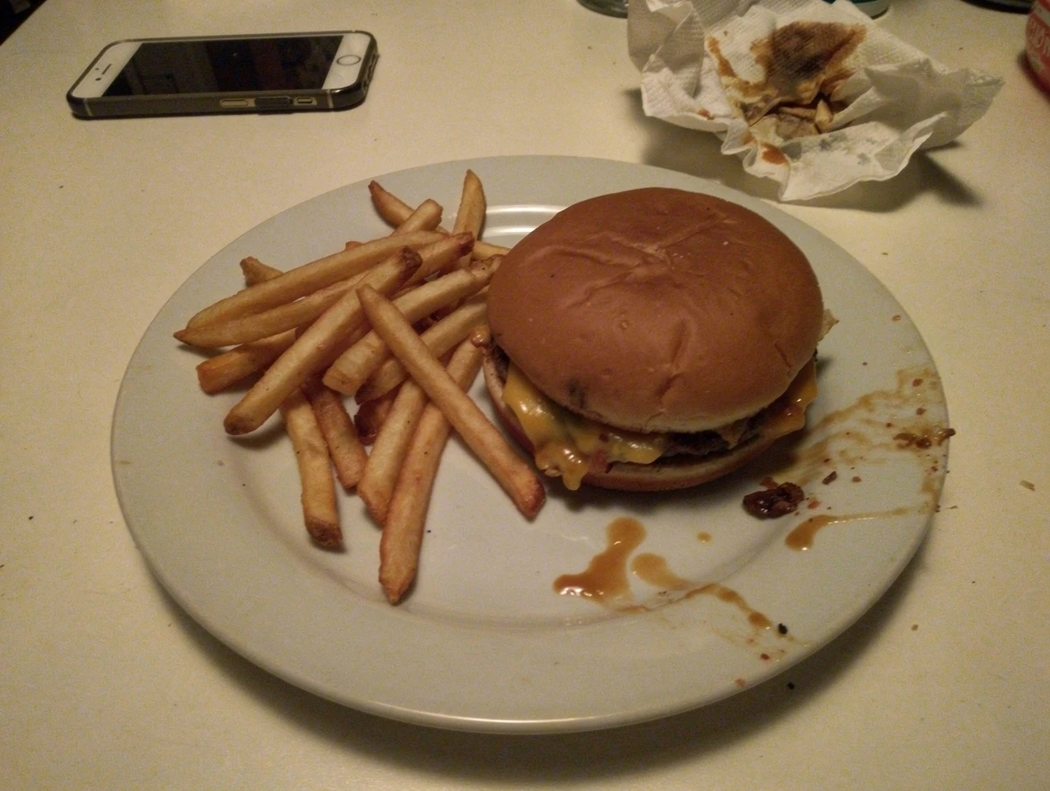 A plate of food photographed in dull indoor lighting